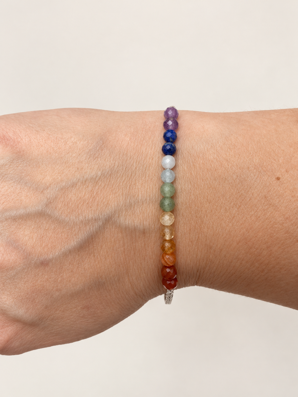 Full Chakra Bracelet with natural crystal beads worn on the wrist
